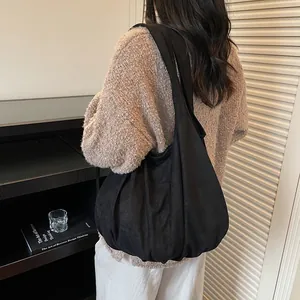 Large black suede tote bag with hobo style design for minimalist casual everyday wear