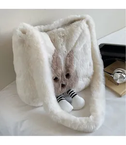 Detailed view of white plush tote bag with cartoon design and wide fluffy shoulder strap
