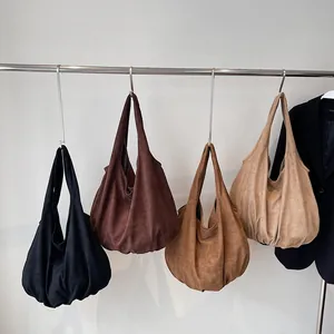 Minimalist large tote bags in four neutral colors with matte texture and slouchy design