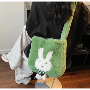 Detail of green plush bunny tote bag with long furry shoulder strap and cartoon design