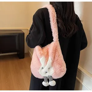 Detail of pink plush rabbit tote bag showing soft texture and cute hanging legs design