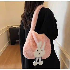 Detail view of pink plush rabbit tote bag featuring striped legs on soft faux fur texture