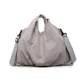 Japanese style minimalist canvas tote bag in light grey with adjustable crossbody strap