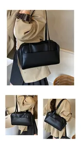 Detailansicht der eleganten schwarzen Ledershopper mit Fokus auf Seiten- und Rücknähte