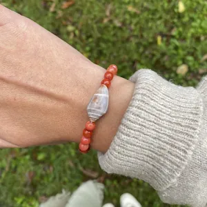 Set bracciale bohémien con pendente conchiglia e perline arancioni stile da spiaggia