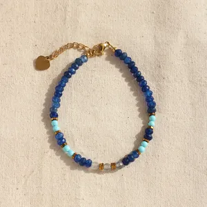 Blue natural stone beaded bracelet with turquoise, gold spacers and heart charm pendant