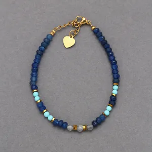 Blue natural stone beaded bracelet with heart pendant and gold lobster clasp closure