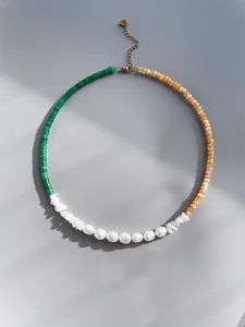 Detail of colorful gemstone beaded necklace with green aventurine and freshwater pearls