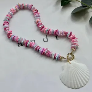 Pink and purple colorful shell beaded necklace with a white scallop shell pendant charm