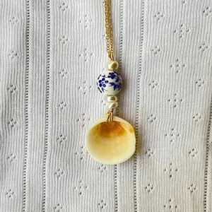 China style necklace with blue and white porcelain beads, shell pendant, and pearls