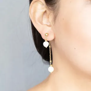 Long gold tassel earrings with natural freshwater pearls for women in minimalist style