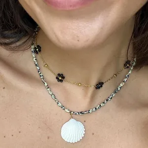 Beaded necklace set with dalmatian stone beads and a white seashell pendant for women