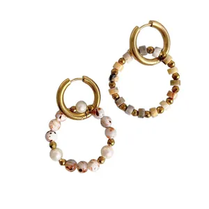 Bohemian gold hoop earrings with colorful natural stones and pearls on white background