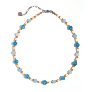 Blue and orange natural stone beaded necklace with white shell beads and heart charm