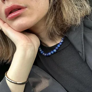 Collana in titanio placcato oro 18k con perline di lapislazzuli e bracciale oro