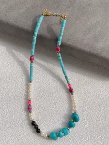 Detail showing natural stones and freshwater pearls with a lobster clasp closure