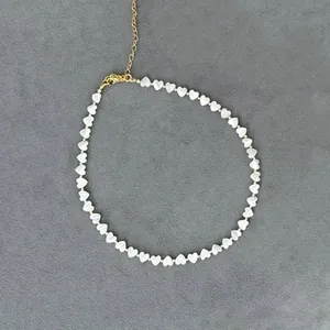 Elegant 18K gold-plated stainless steel necklace with white heart-shaped shell beads
