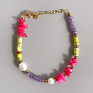 Detail of multi-color beads with freshwater pearls and gold lobster clasp jewelry