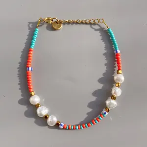 Detail of beaded bracelet with freshwater pearls, colorful seed beads, and lobster clasp