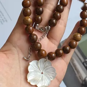 Vintage shell flower necklace with brown wood beads and adjustable lobster clasp closure