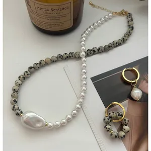 Elegant Baroque pearl and Dalmatian stone jewelry set with golden metal hoop earrings