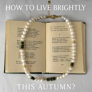 Elegant freshwater pearl necklace with turquoise beads on vintage book background