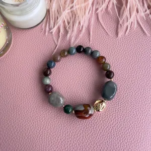 Bohemian natural stone beaded bracelet with marble textures and gold metal accents