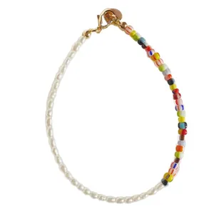 Handmade bracelet with natural freshwater pearls and vibrant colorful glass beads