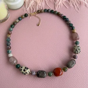 Mixed natural stone beaded necklace with gold heart clasp and assorted colorful gemstones