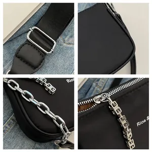 Detailed views of black nylon shoulder bag showing silver hardware and metal chain links