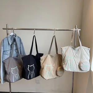 Spacious canvas tote bags with cat prints in dark grey, black, khaki, and off-white colors