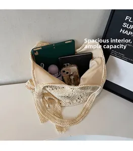 Macro shot showing the spacious interior and woven texture of the beige tote bag