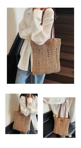 Close-up of handmade straw shoulder bag with wavy weave texture and brown leather strap