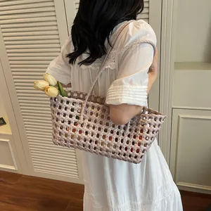 Handcrafted lilac woven hollow tote bag with long straps for beach or daily use