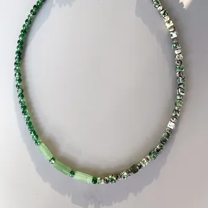 Handmade necklace with natural stones and freshwater pearls in vibrant green tones