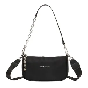 Minimalist black nylon shoulder bag with silver chain and wide fabric strap in main view