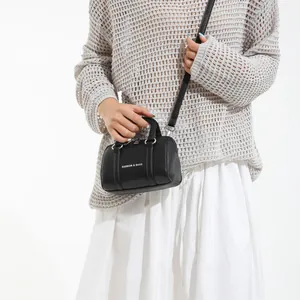 Black pebbled leather Boston bag with fashion lettering and adjustable crossbody strap