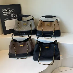 Chic quilted chain bags in multiple colors displayed on white minimalist platforms