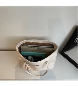 Top view of spacious tote bag interior showing large capacity for laptop and books