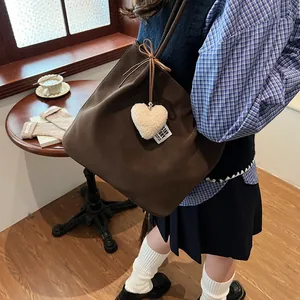 Vintage brown matte suede tote bag with plush heart charm for women's daily commute