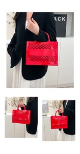 Detail of red hollow jelly tote bag with diamond mesh pattern and soft PVC handles
