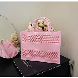 Close-up of pink jelly beach tote bag showing intricate hollow-out mesh pattern and texture