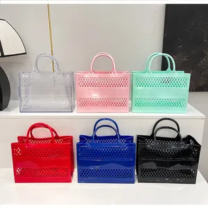 Detailed row of various colorful hollowed-out jelly tote bags on display steps