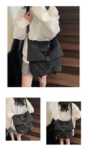Λεπτομέρεια μαύρης μεγάλης τσάντας crossbody utility με ιμάντες και υφή νάιλον