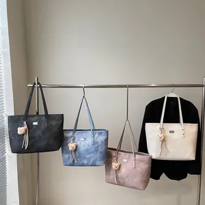 Modern solid color tote bags in four colors with bear charms and metal logo plates