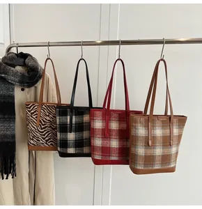 Selection of zebra print and plaid oversized tote bags for autumn winter outfit styling