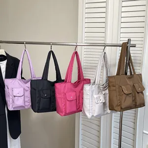 Quilted nylon tote bags in various colors featuring large capacity and multiple pockets