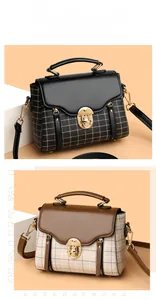 Detail of vintage plaid crossbody bags with gold metal locks and dual zipper accents