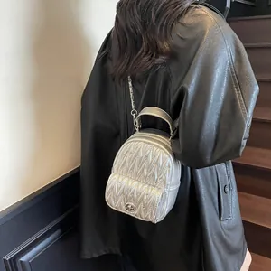 Silver quilted Matelassé backpack with chain straps and metallic finish for women