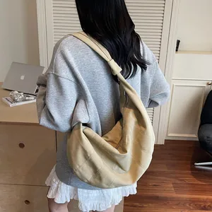 Large khaki crescent dumpling bag with wide shoulder strap and metal zipper